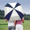 Two people holding The Square Vented Auto Open Sporty Golf Umbrella