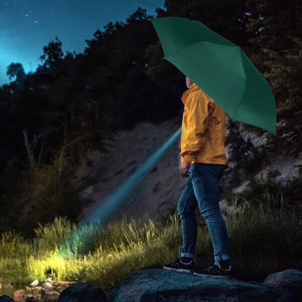 Man using The Storm Flash Flashlight Folding Umbrella
