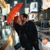 couple kissing while holding The Victory Deluxe Auto Open Umbrella