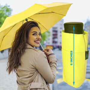 a woman holding the Mini Mates Shockingly Compact Travel Umbrella