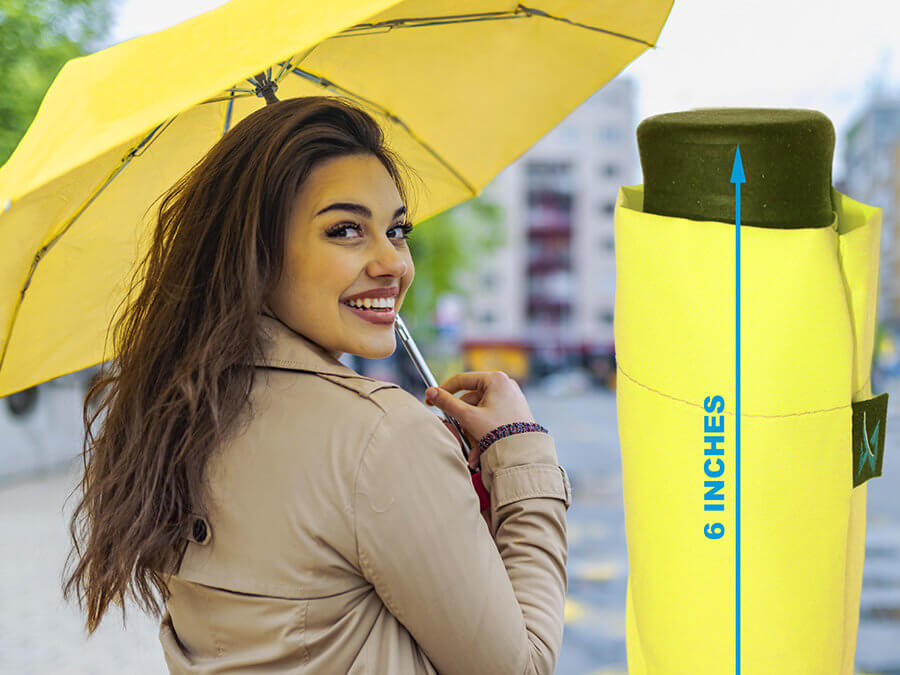 a woman holding the Mini Mates Shockingly Compact Travel Umbrella